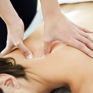 young-woman-receiving-back-massage-spa-center (1)